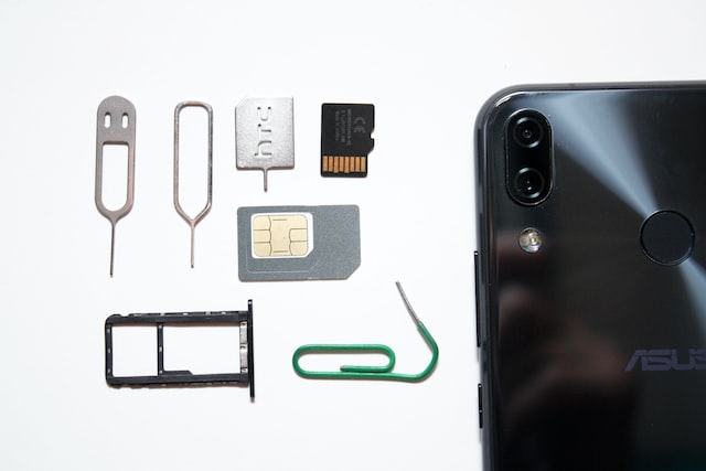 grey sim card near the phone