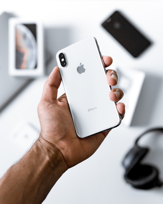 person holding white iphone