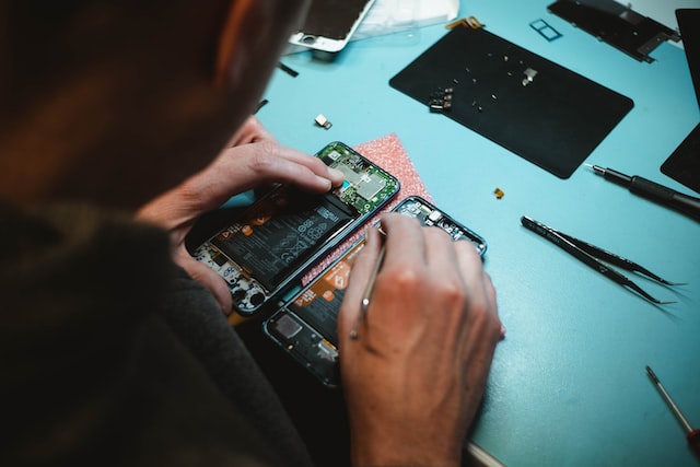 person repairing phone